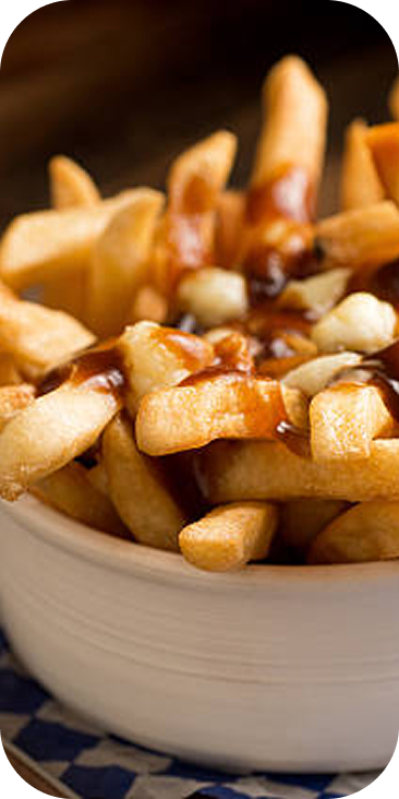 Close-up of cheese curds melting on fries